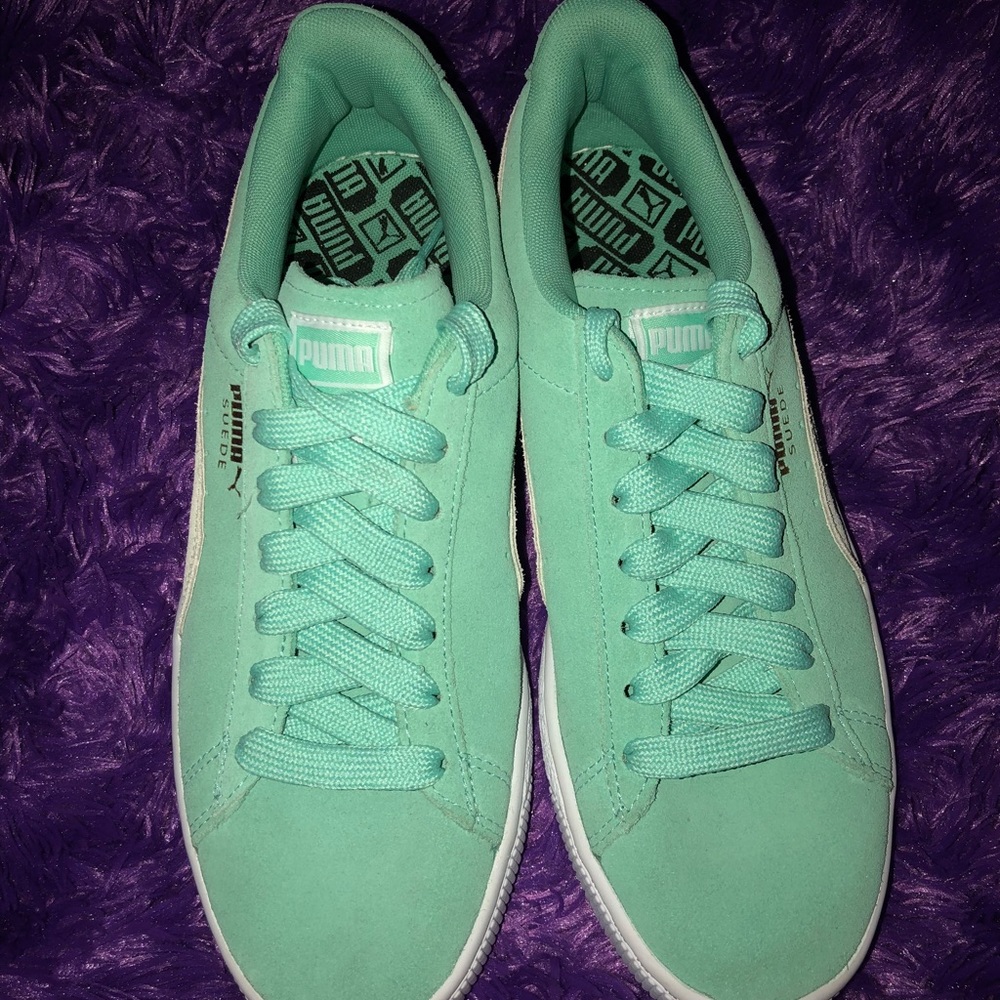 Green women’s puma shoes.